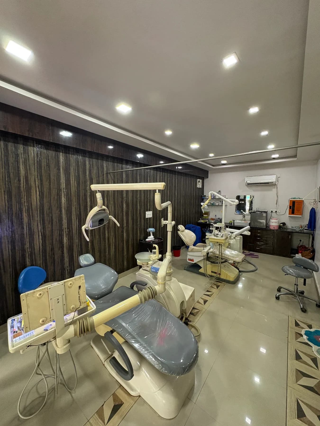 Wide view of Oro Care dental treatment room with dental chairs and clinical equipment